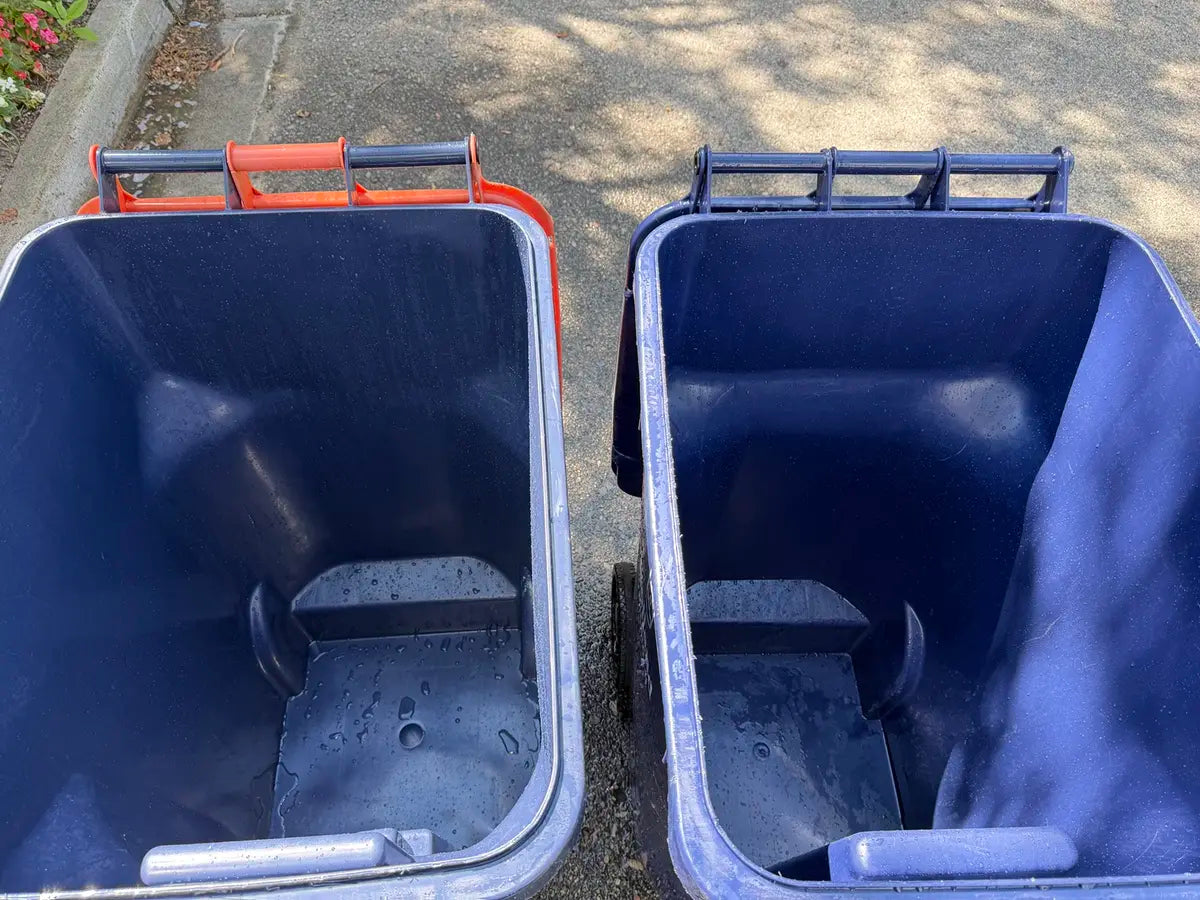 Two residential rollaway bins together after BC Bin Clean service
